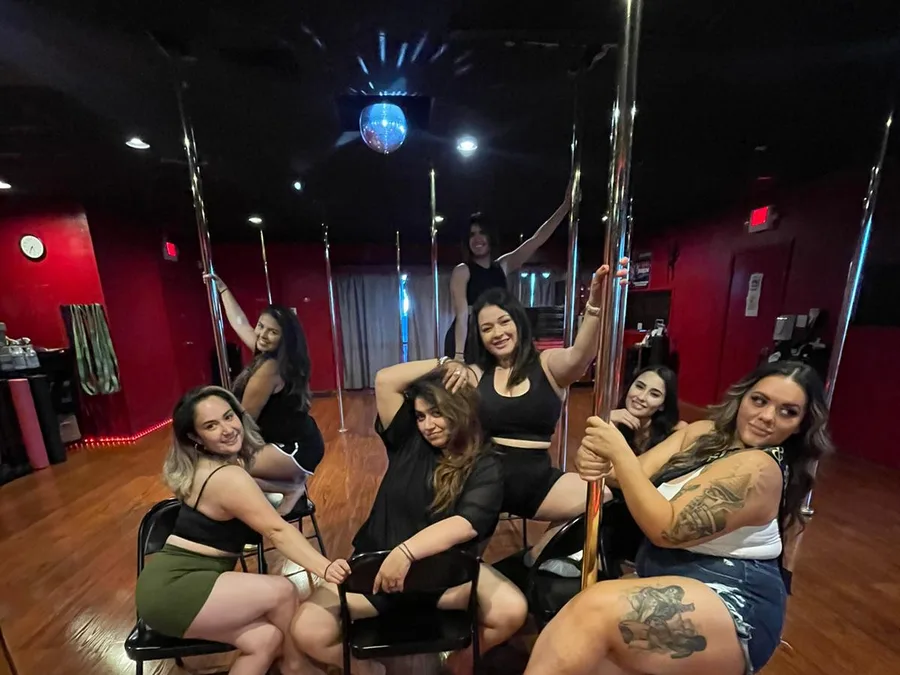 Friends celebrating together at a Pole Fitness Studio party